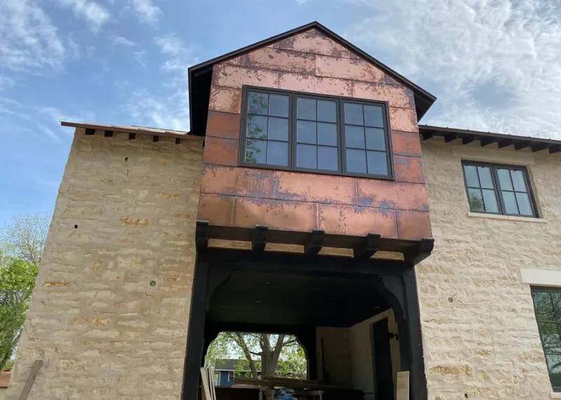 Copper metal panel facade on a stone building for Metal Roof Coating in Buena Park