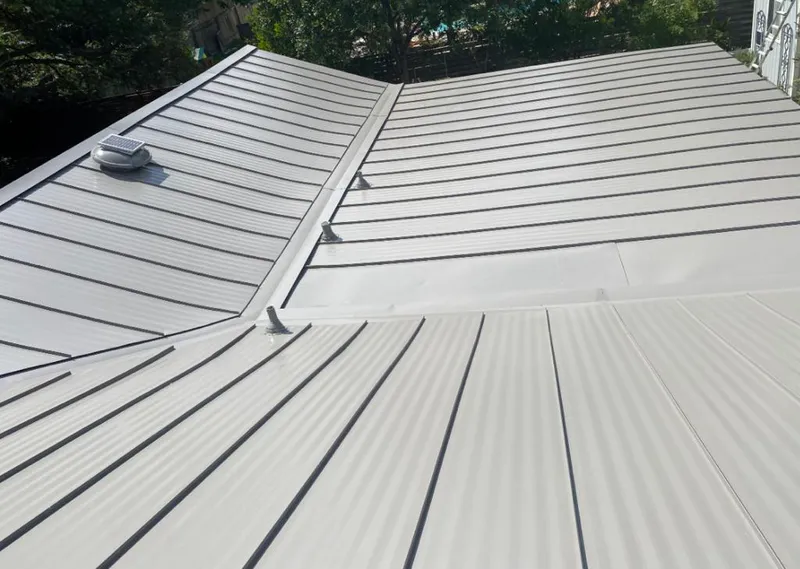 Solar attic fan installed on a metal roof for Roof Ventilation in Buena Park